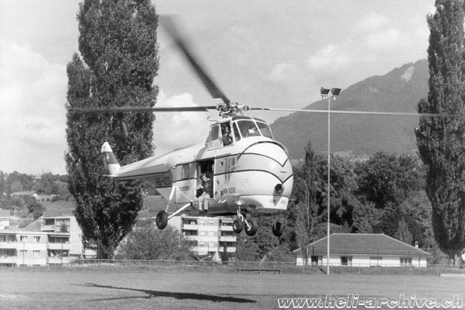 Summer 1975 - The Helitech-Sikorsky S-55T HB-XDS photographed while it hovers over a soccer field. The pilot is Ernest Devaud (E. Devaud) 