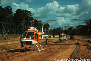 Suriname '70s - The Bell 206A/B Jet Ranger II HB-XCP together with the Agusta-Bell 204B HB-XCG both in service with Heliswiss (P. Aegerter)